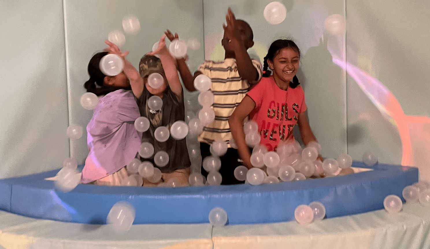 Child plays in ball pit