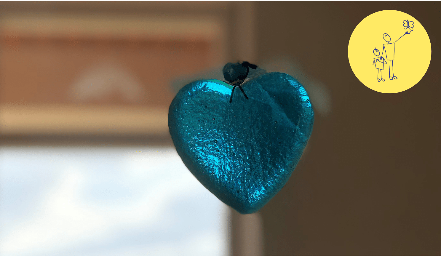 Wooden heart sign with words "Love you to the moon and back"