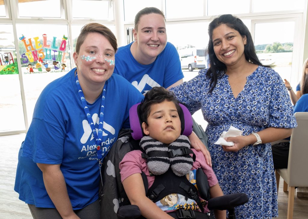 Alexander Devine team, hands in.